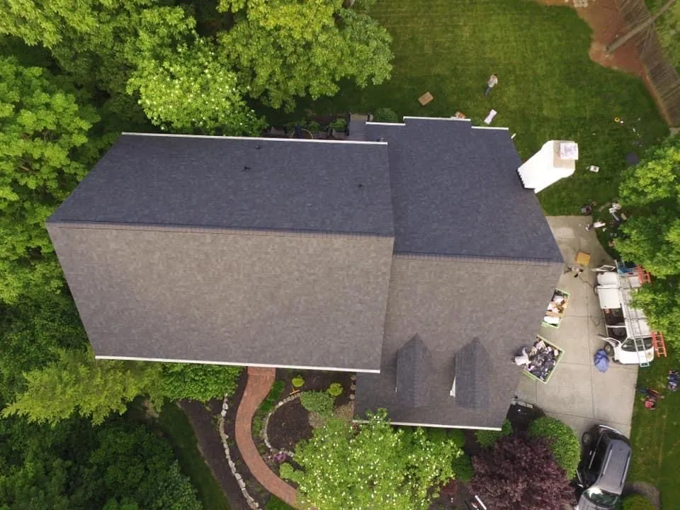 Overhead drone photo of a dark shingle roof