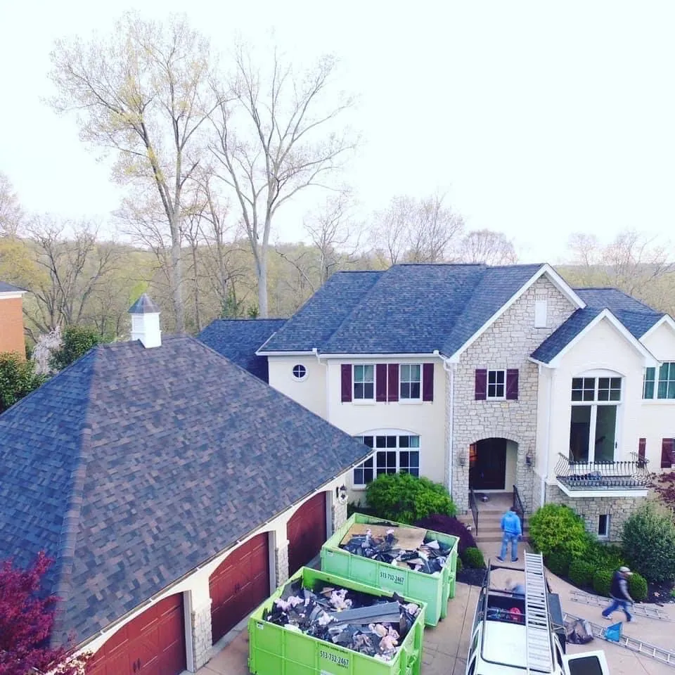Finished blue shingle roof on a large home