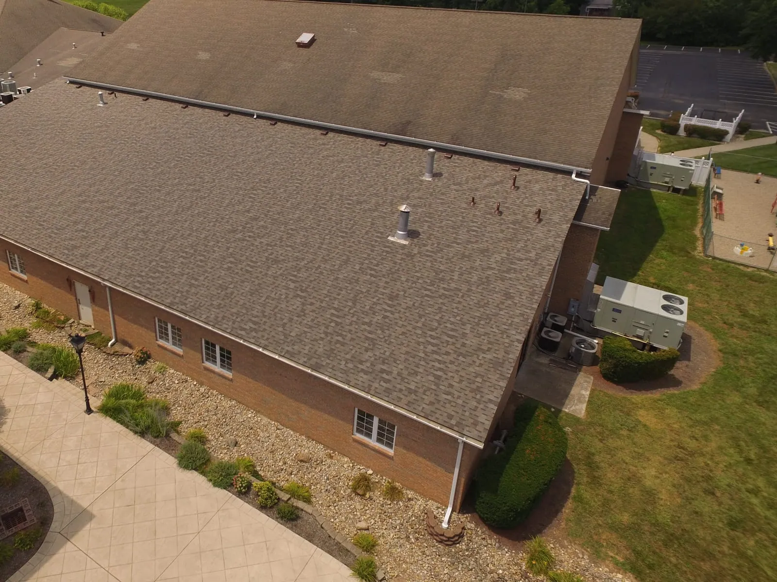 Finished brown shingle roof on a church