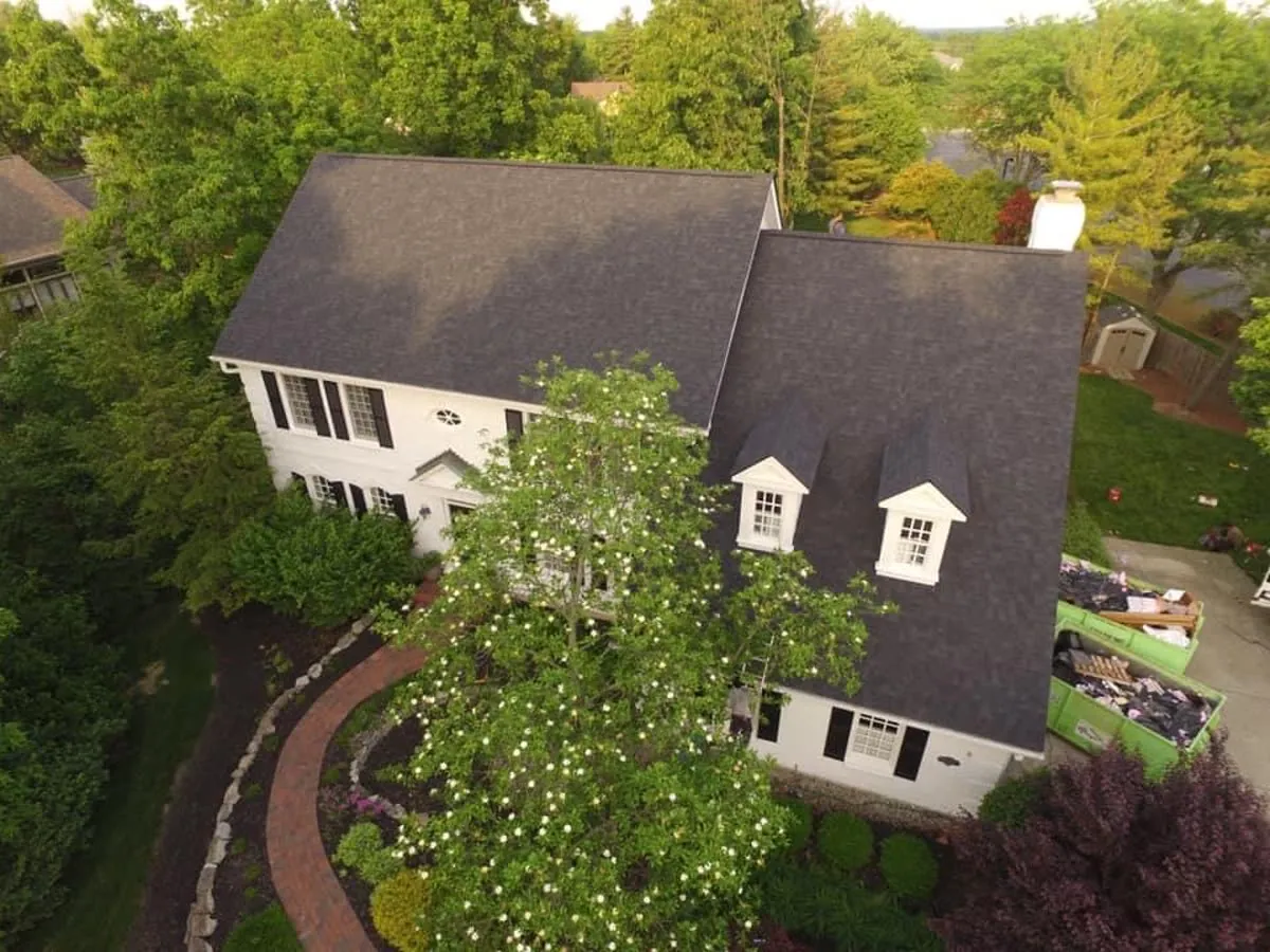 Finished dark shingle roof with dormers