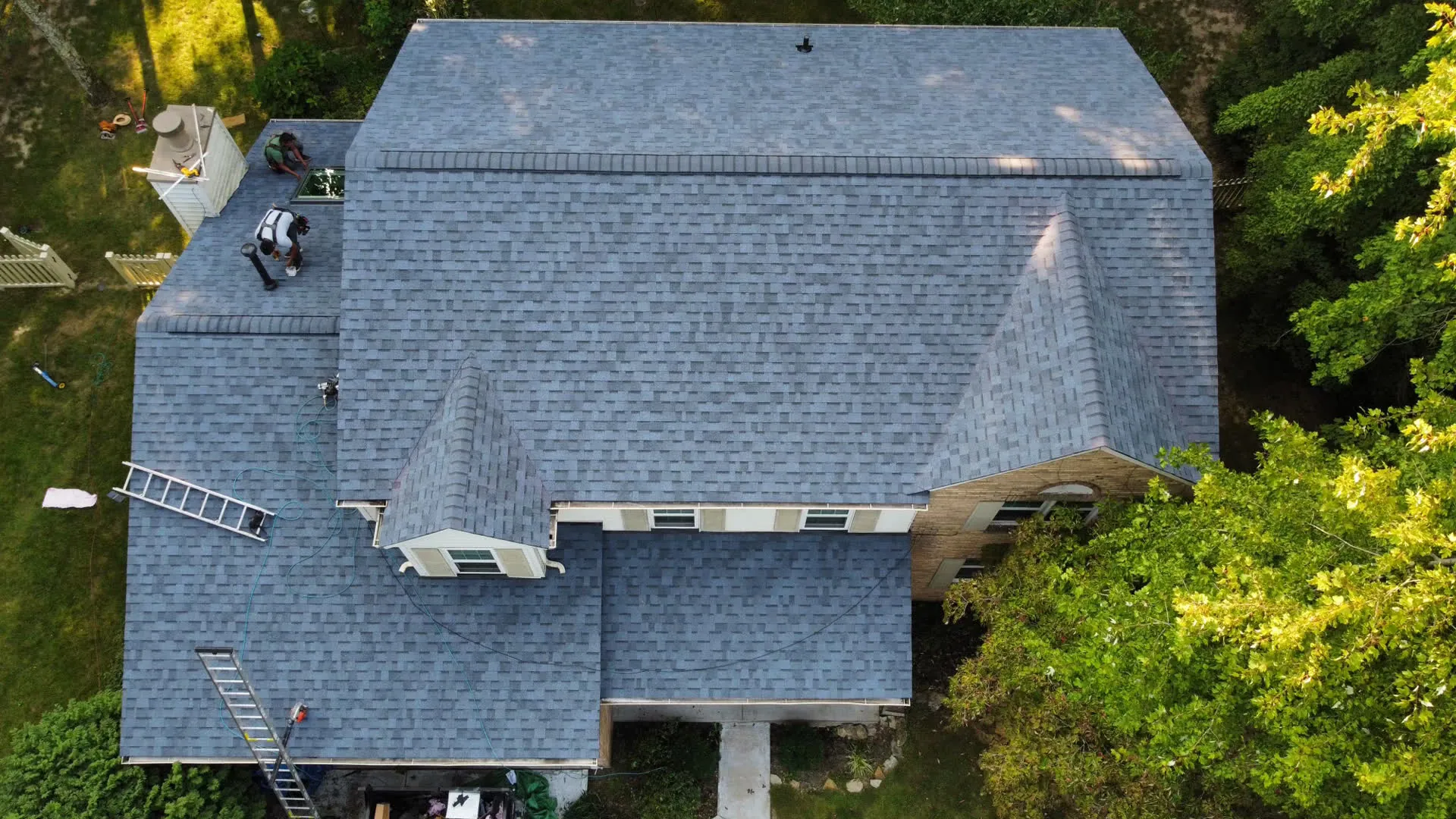 Overhead drone photo of a finished shingle roof