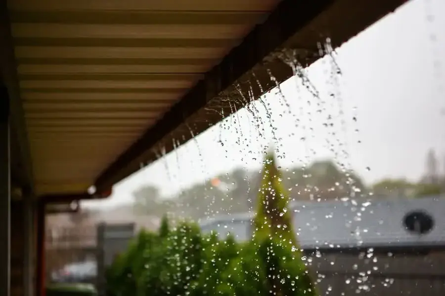 Rain running off the edge of a roof