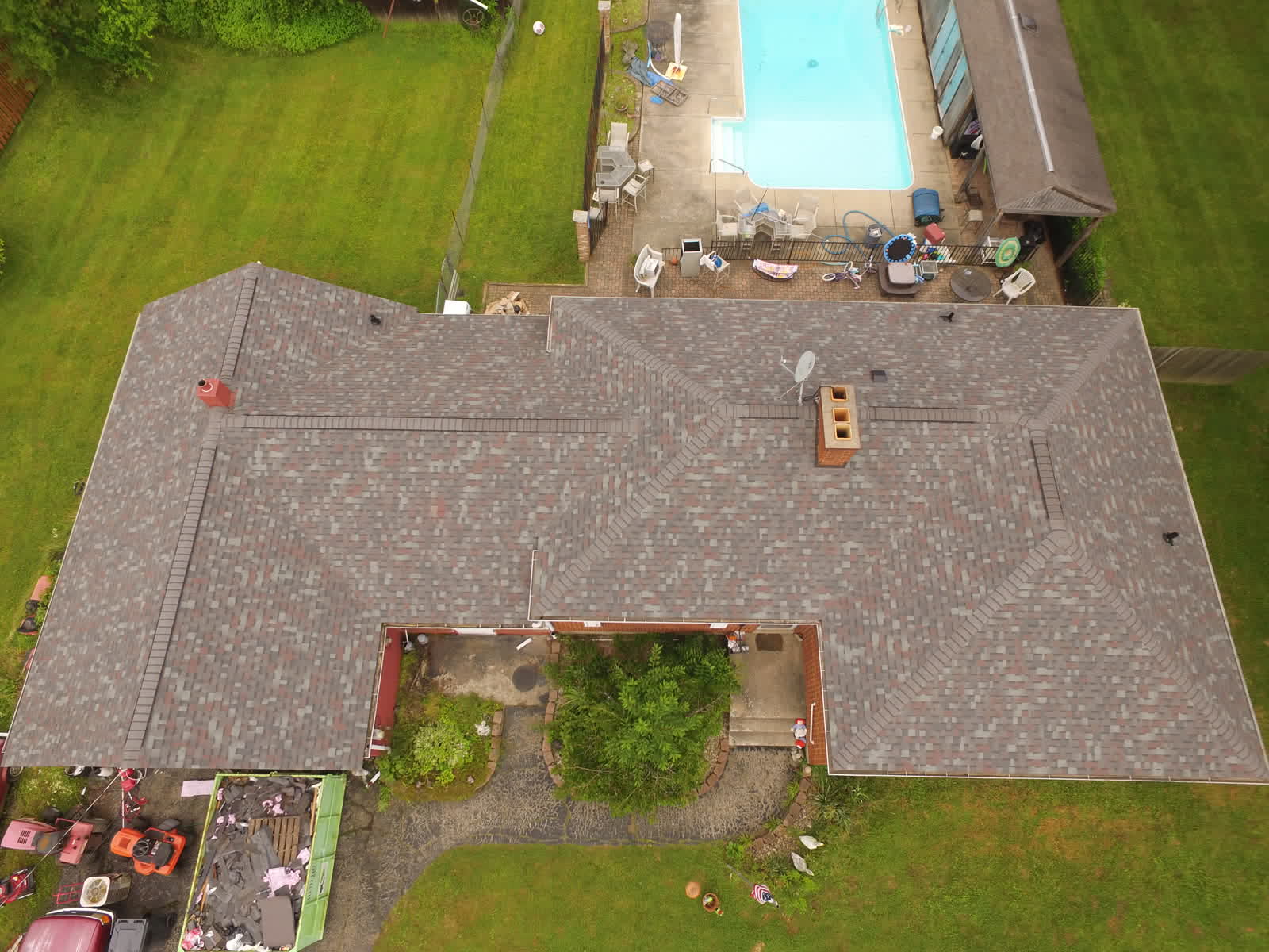 Overhead drone photo of a new gray shingle roof