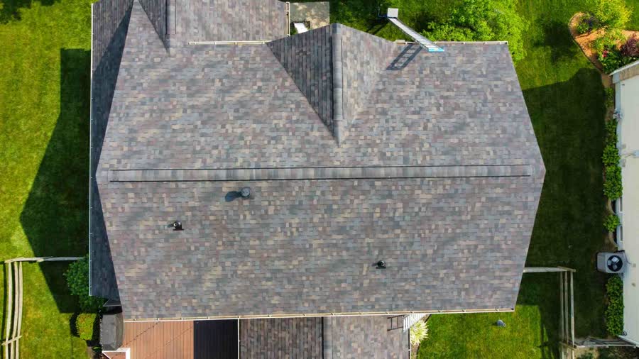 Overhead drone photo of a gray shingle roof