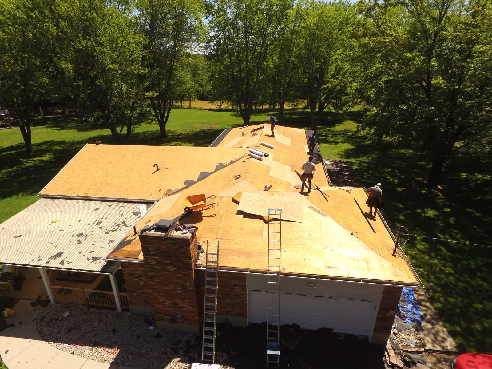 Drone photo of a roof replacement: decking exposed during tear-off
