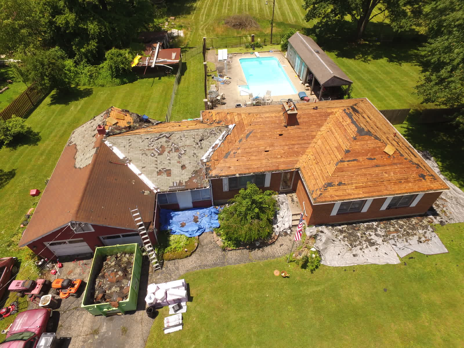 Drone photo of a roof replacement: the roof stripped to the decking