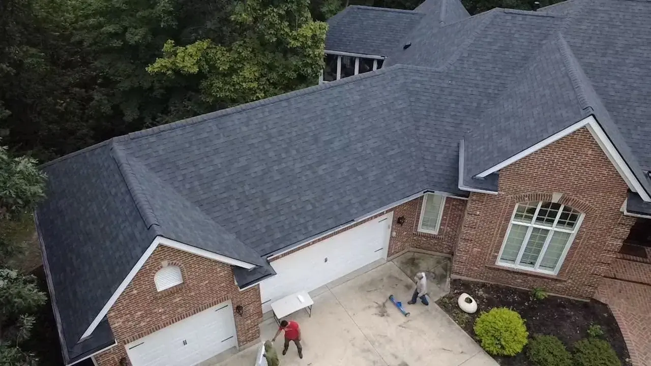 Shingle roof and garage on a brick home